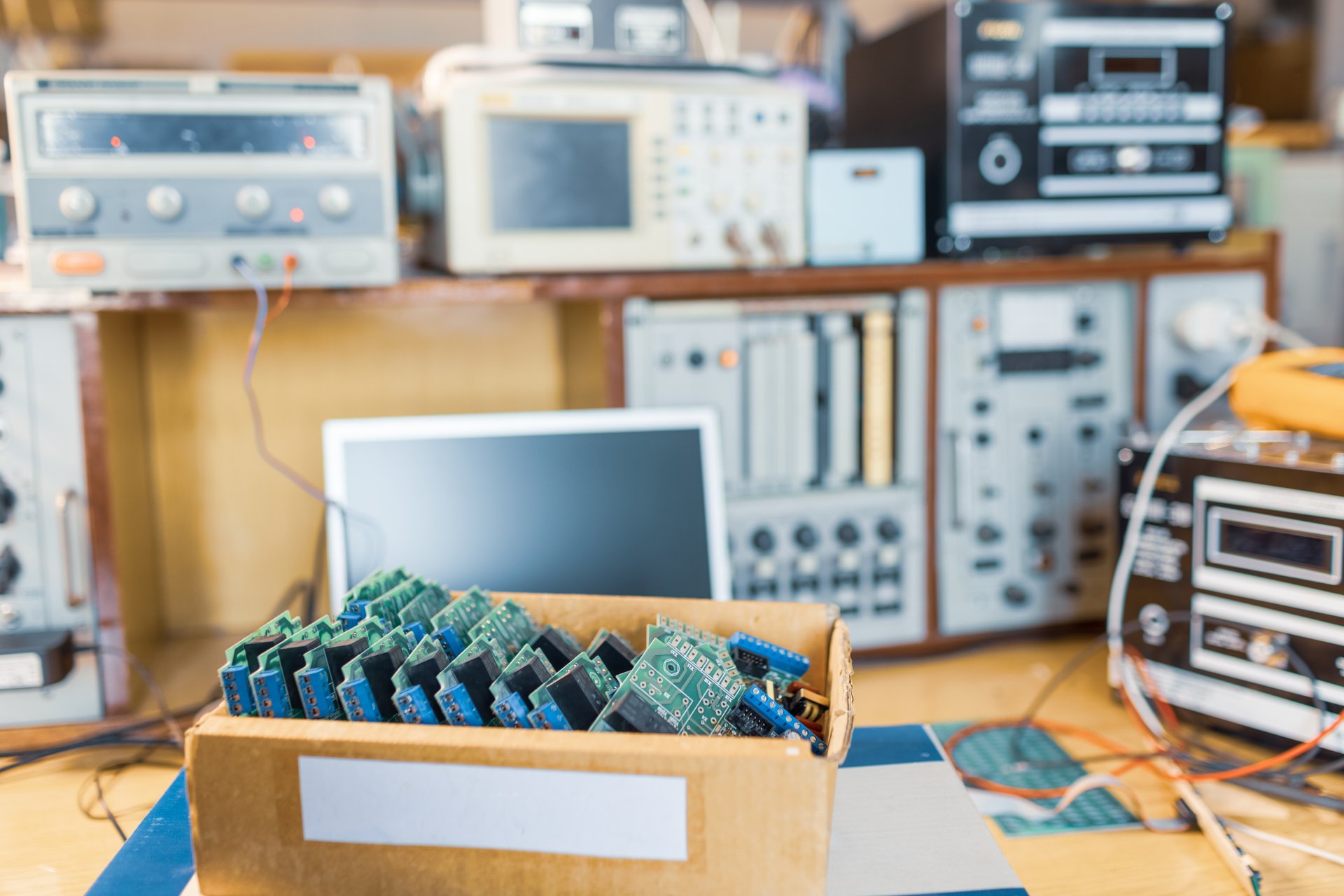 Close-up of electric green embedded microcircuits on a circuit board