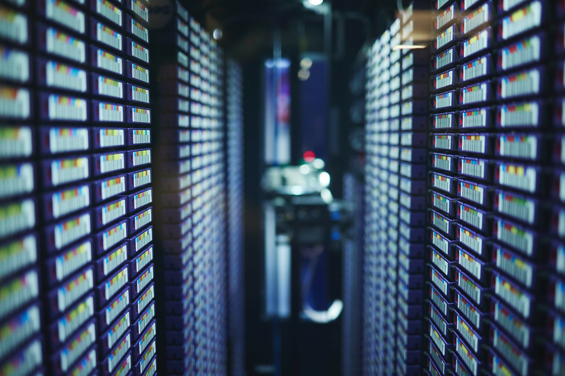 Server equipment in a data center with orange emergency lighting